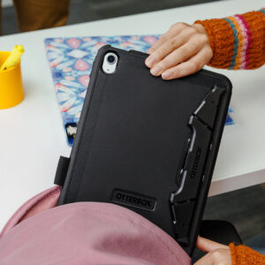 OtterBox Business encased tablet being placed into a backpack