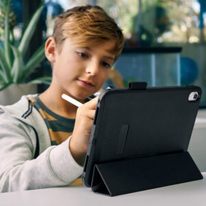 Young boy using a tablet with a pen
