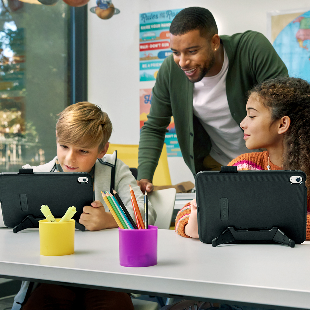 Teacher and two students with tablets