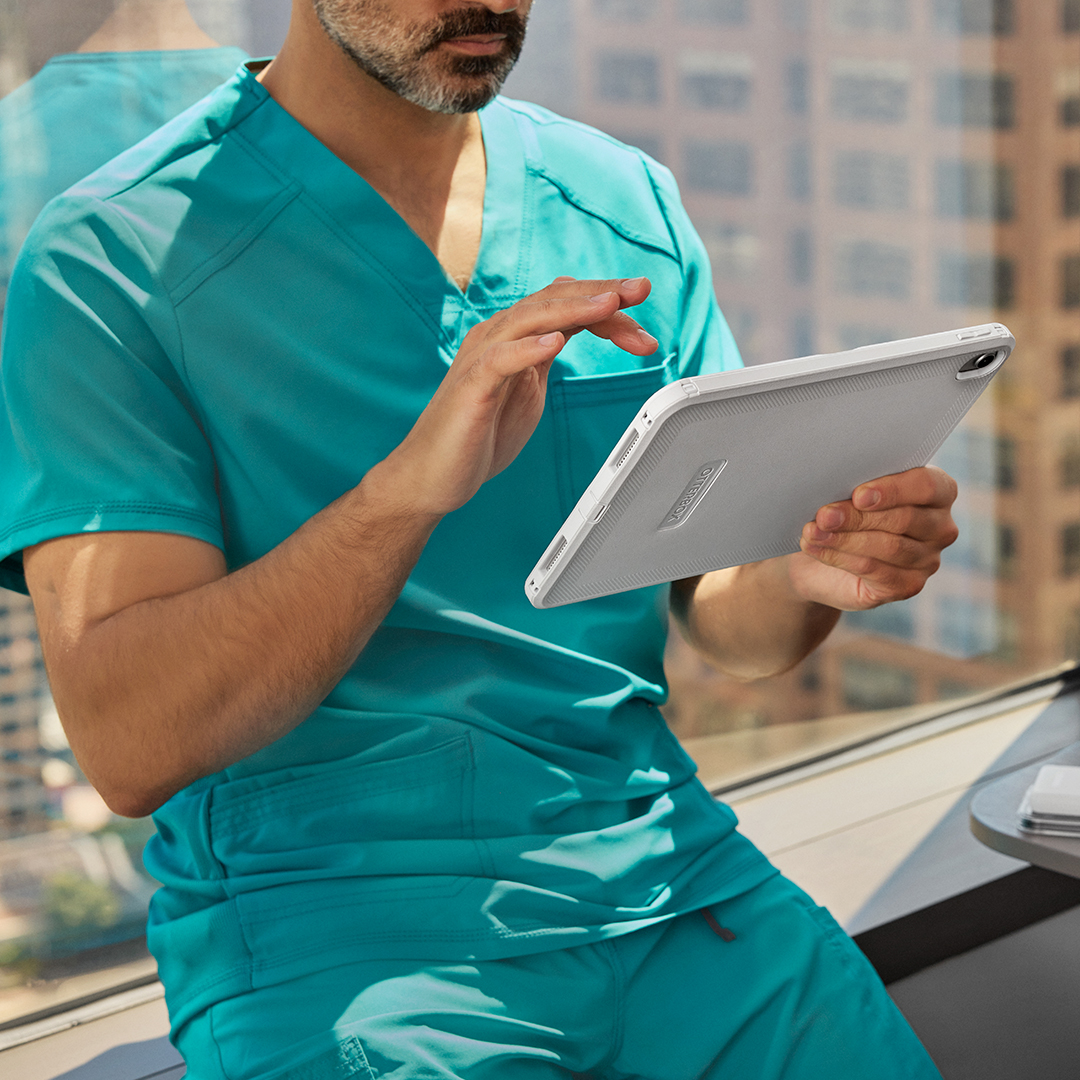 Healthcare professional holding tablet